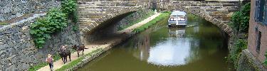 Photo of canal boat under Wisconsin Avenue Bridge in Georgetown.